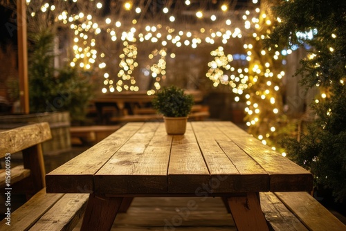 Romantic outdoor dining setup with string lights and a potted plant in the ev...