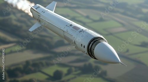 High-speed missile flying over countryside landscape with exhaust trail in clear sky