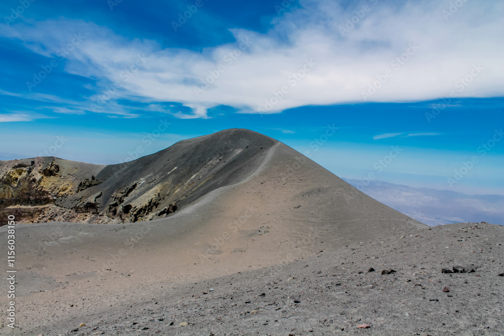 El Misti volcano crater in Peru near the city of Arequipa in Atacama desert. Sandy volcanic slopes covered with ash inside the huge crater of active volcano El Misti on a sunny day with blue sky El Misti volcano crater in Peru near the city of Arequipa in Atacama desert. Sandy volcanic slopes covered with ash inside the huge crater of active volcano El Misti on a sunny day with blue sky