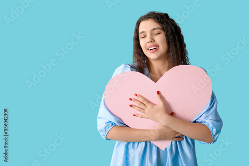 Happy young woman embracing...