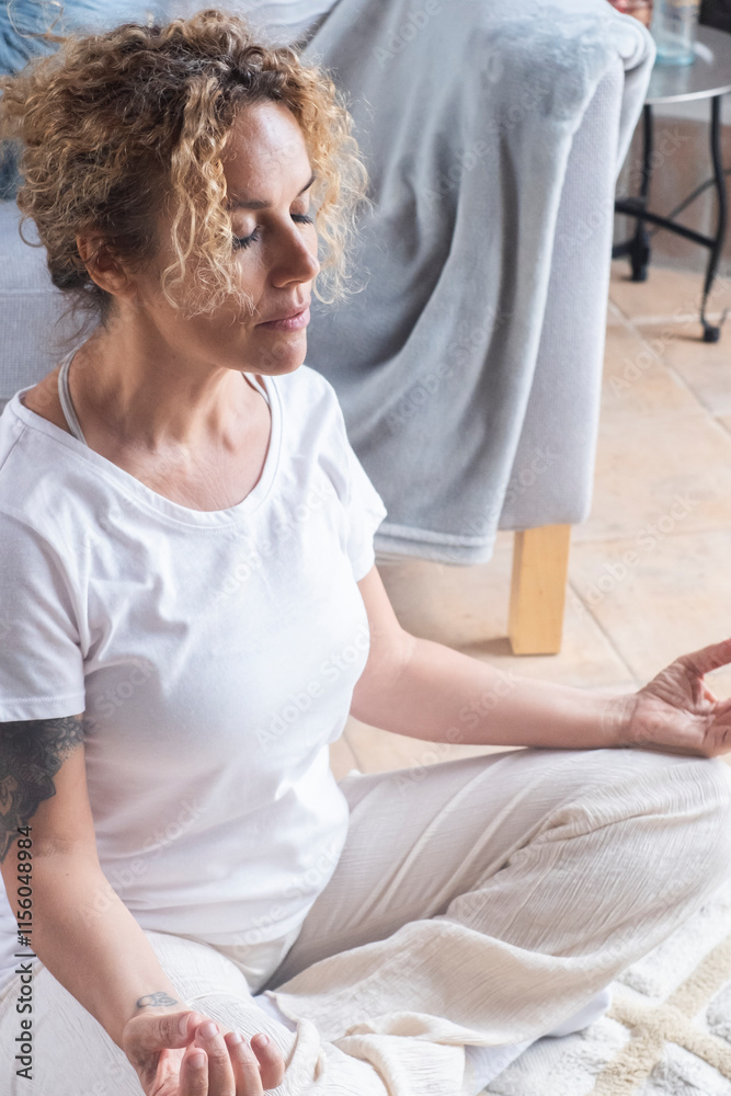 Woman meditating and breathing deeply in lotus position on the floor at home, focusing on mental health, personal growth, and inner peace while practicing yoga for wellness in a peaceful, Woman meditating and breathing deeply in lotus position on the floor at home, focusing on mental health, personal growth, and inner peace while practicing yoga for wellness in a peaceful,