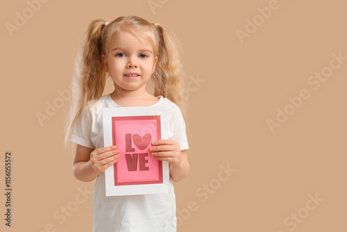 Cute little girl holding gr...