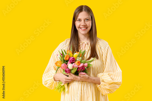 Smiling young woman holding...