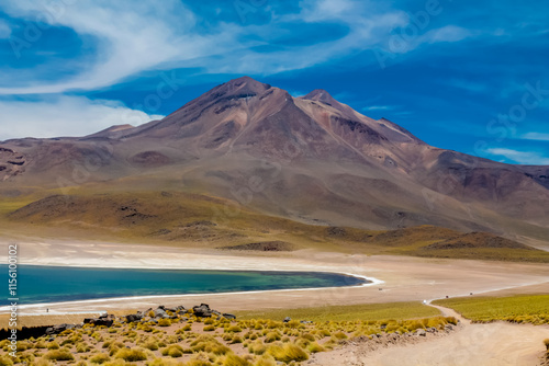 Lakes in the desert Atacama landscape in Chile. The view point to the green crystal lakes, volcanoes and mountains. Lookout Mirador Laguna Miniques and Miscanti in San Pedro de Atacama desert