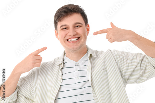 Smiling young man pointing ...