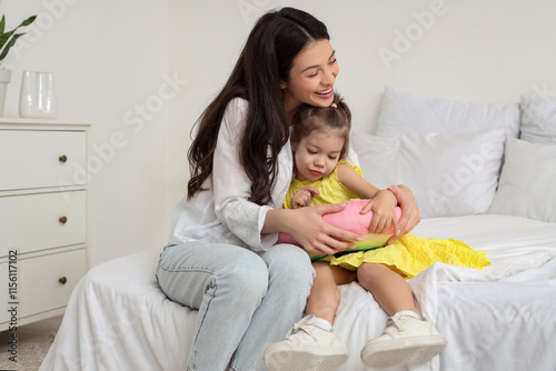 Young mother and her little...