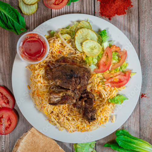 Slow-Cooked Lamb over Biryani Rice with Fresh Vegetables and Sauce

