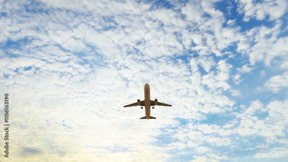 Naklejka premium ULTRA HD. Airplane flies in blue sky. Travel, tourism. Airplane takes off against the background of blue sky. 