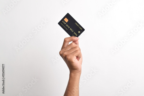 Close up of hand with black credit card isolated on white background. Shopping, finance and people concept