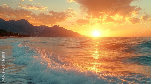 A serene sunset over the ocean with gentle waves and mountains in the background.
