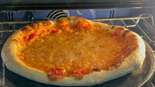 homemade pizza still baking in oven