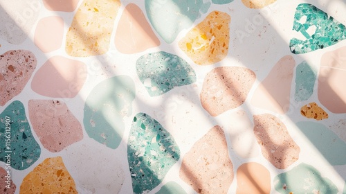 Abstract Terrazzo Texture Pastel Pink, Teal, and Beige Stone Mosaic with Sunlit Shadows -  High-Resolution Background Image photo