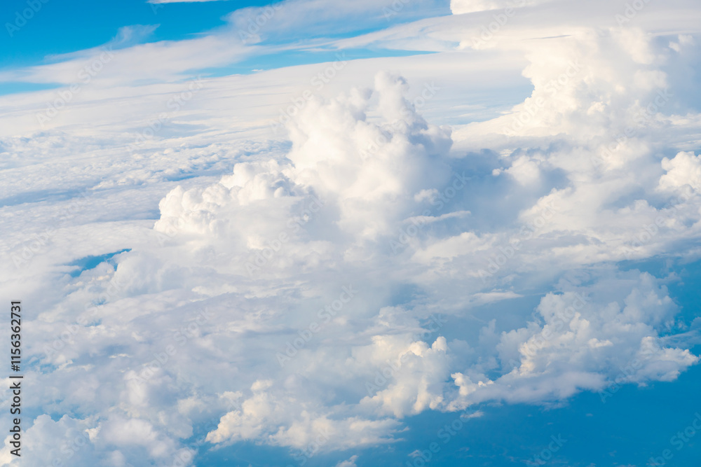 Fototapeta premium Blue sky with clouds in the sky. Beautiful blue sky background with clouds.Natural and cloudy fresh blue sky background. White fluffy clouds in the blue sky.