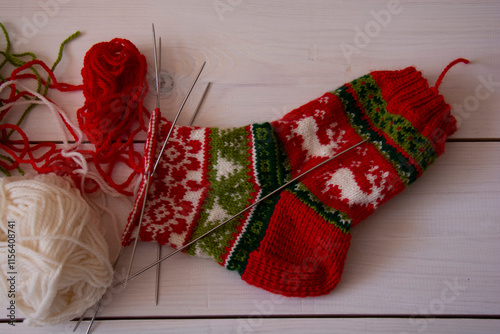 Beautiful New Year's socks and skeins of yarn in the process of knitting
