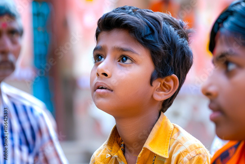 A young Indian boy receives counsel, his mind open to possibilities, his heart receptive to lessons learned, his journey enriched by the guidance of elders. photo