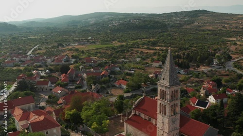 Drone Flying Above Nerezisca Village And Church In Brac Island, Dalmatia, Croatia. Wide Shot photo