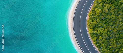 coastal highway freedom concept. Curved road by turquoise water and lush greenery.