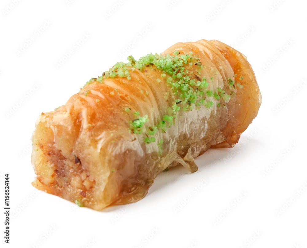 Dessert roll filled with nuts and topped with green pistachio powder served on a white background Dessert roll filled with nuts and topped with green pistachio powder served on a white background