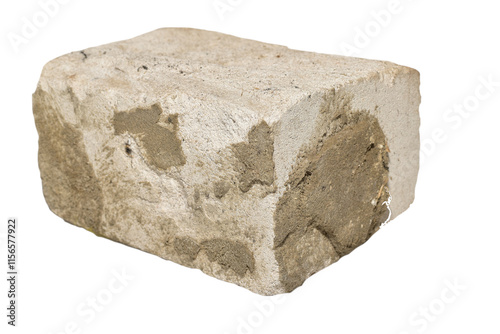 Isolated on white background half of sand-lime brick with hardened mortar. photo