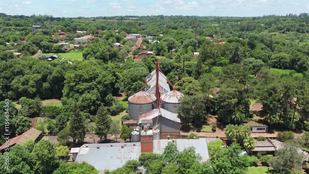 Drone advancing over a grain mill in rural Hohenau, Itapúa, Paraguay. Drone advancing over a grain mill in rural Hohenau, Itapúa, Paraguay.