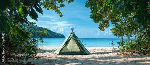 Serene beach scene with a green tent amid lush greenery and clear blue sea providing ample copy space for text and creative projects photo