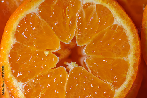 Bright orange citrus fruit section showcases juicy segments under soft light in a warm setting