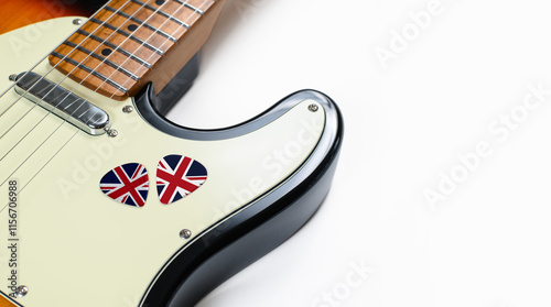 Close-up of picks with UK flag on electric guitar. Empty space. Selective focus. British rock music photo