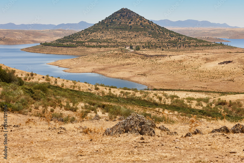 Picturesque hill pyramidal shape huge roundabout and road. Extremadura, Spain
