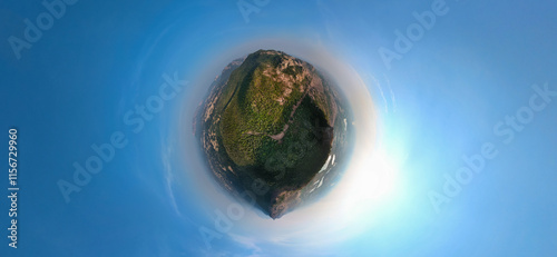 tiny planet aerial view, spherical forest landscape, drone panoramic photography, lush green mountain view, unique 360-degree nature perspective, circular earth view stock photo. photo