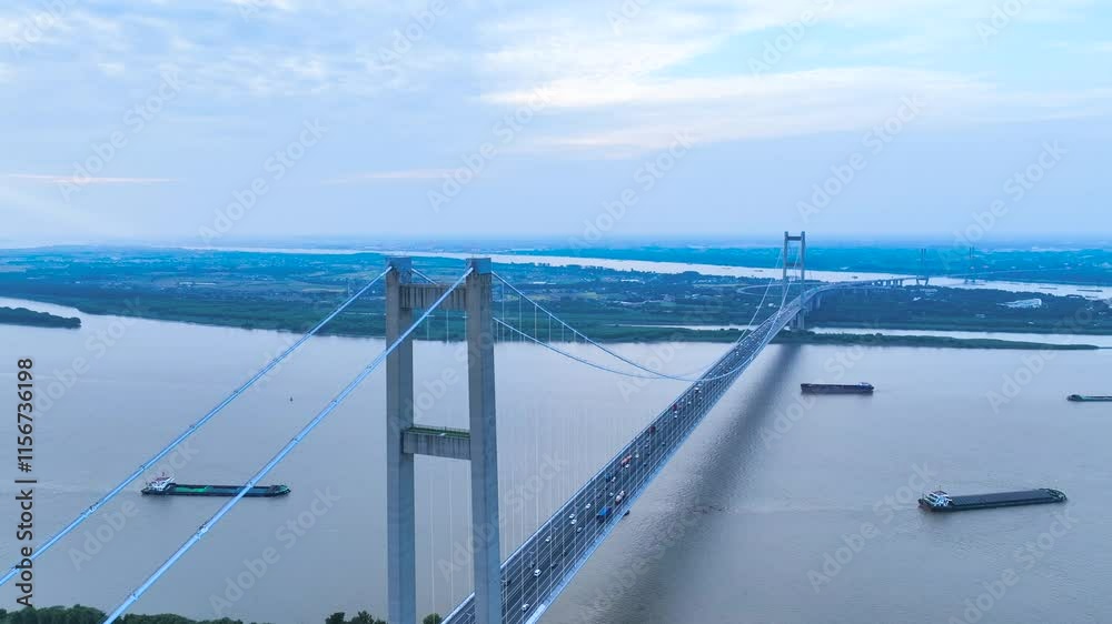 Explore traffic flow at Runyang Bridge with stunning aerial photography over the Yangtze River in Jiangsu Province Explore traffic flow at Runyang Bridge with stunning aerial photography over the Yangtze River in Jiangsu Province