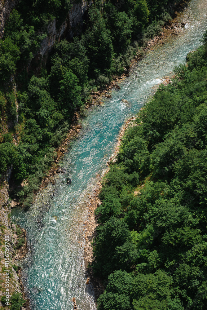 Tara river view from above from the bridge in Durmitor nature reserve, Montenegro summer. Mountains, forest, river panorama Tara river view from above from the bridge in Durmitor nature reserve, Montenegro summer. Mountains, forest, river panorama