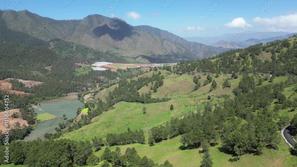 Aerial view of the agricultural landscape in the lush high valley of Constanza in the central range of the Dominican Republic Aerial view of the agricultural landscape in the lush high valley of Constanza in the central range of the Dominican Republic