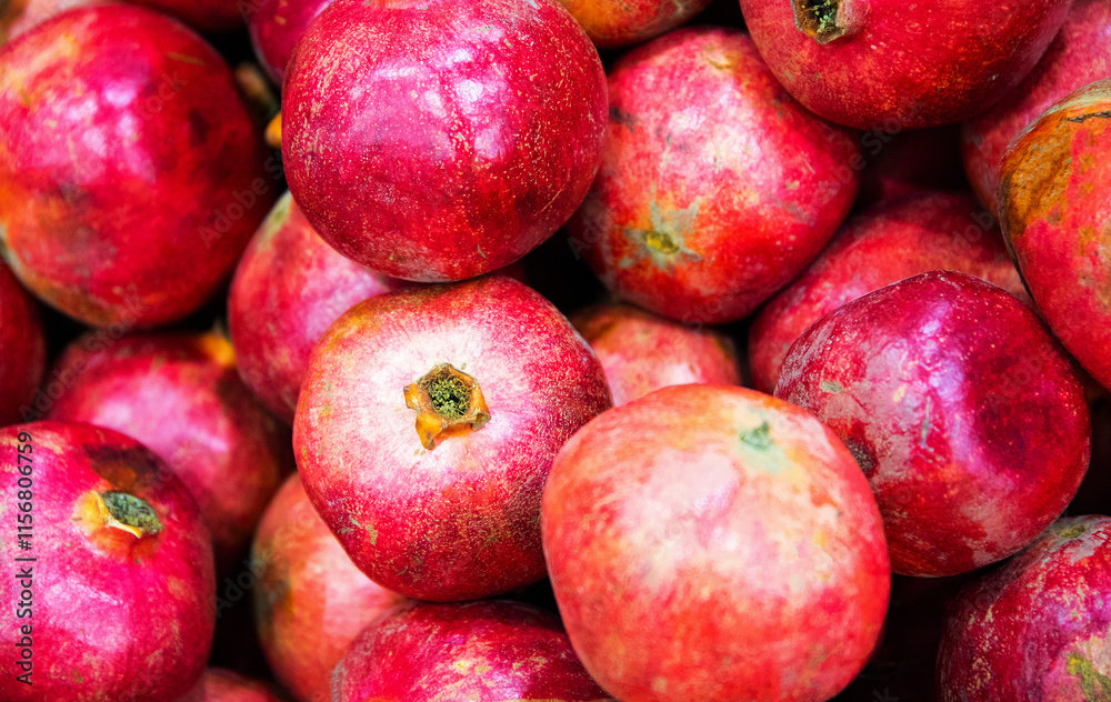 Pomegranate, ripe pomegranate fruits at a market in Cairo, Egypt Pomegranate, ripe pomegranate fruits at a market in Cairo, Egypt