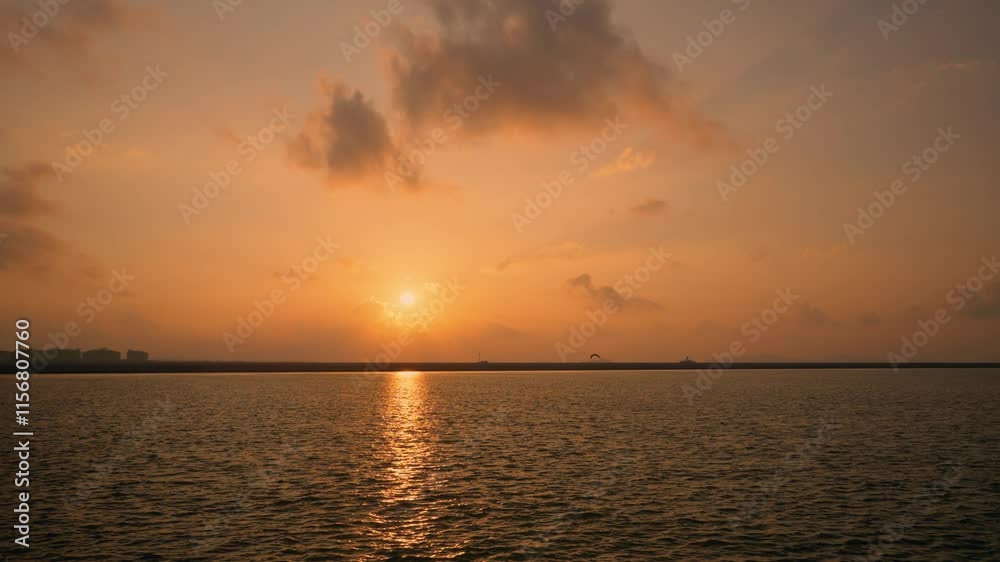 Golden Sun Shining Over The Yellow Sea From Incheon In South Korea. - wide shot, bird silhouette flying above horizon Golden Sun Shining Over The Yellow Sea From Incheon In South Korea. - wide shot, bird silhouette flying above horizon