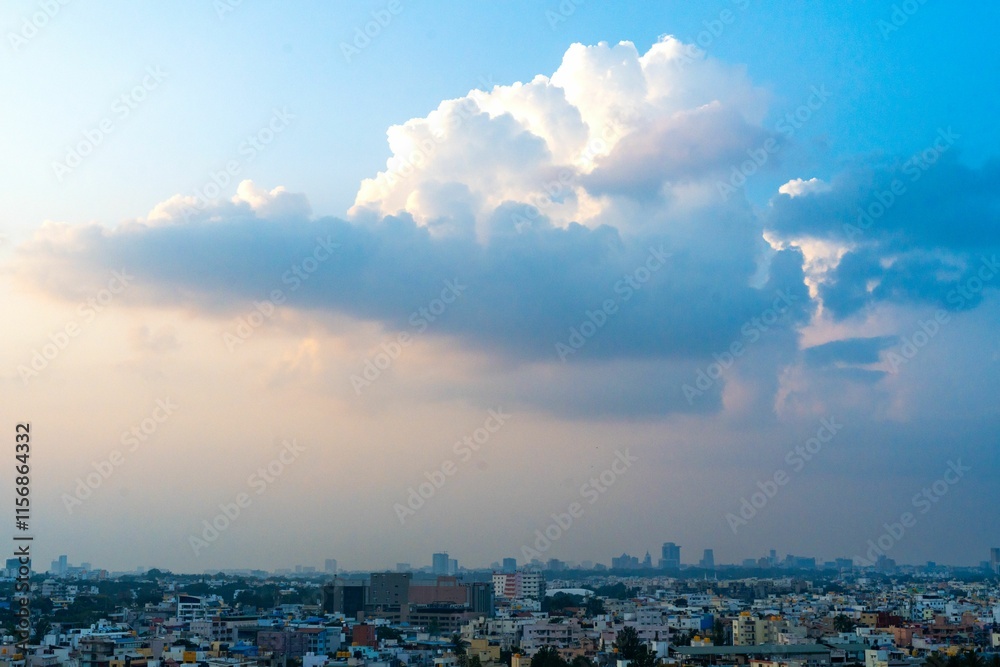 Cityscape with dramatic clouds at sunset. Cityscape with dramatic clouds at sunset.