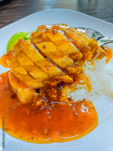 Crispy pork with rice and sauce, thai style.