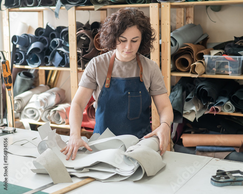 Woman tanner at work in the workshop.  photo