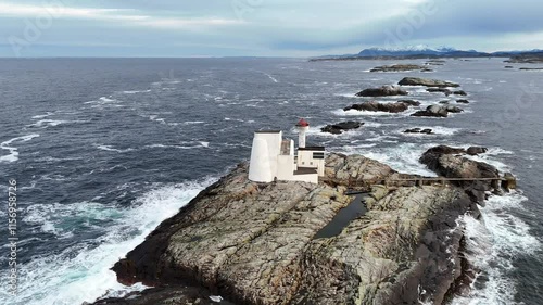 Aerial footage of the Hestskjaeret lighthouse in Averoy Municipality in More og Romsdal, Norway photo