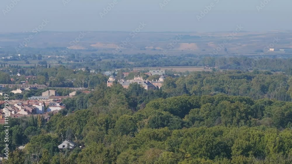 Drone flight and with a turn we discover the domes of the royal palace and many treetops in its gardens, we continue seeing part of the town, in the background we have plateau mountains Drone flight and with a turn we discover the domes of the royal palace and many treetops in its gardens, we continue seeing part of the town, in the background we have plateau mountains