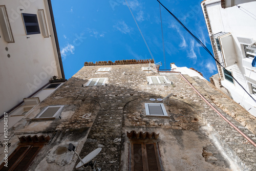 Fototapeta Naklejka Na Ścianę i Meble -  White old houses and narrow streets in medieval small touristic coastal town Sperlonga, Latina, vacation in Italy