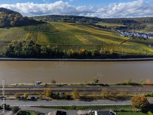 Aerial view of terraced vineyards around Nittel, Rhineland-Palatinate, Germany and views across Moselle River on vineyard hills of Machtum, Luxembourg photo