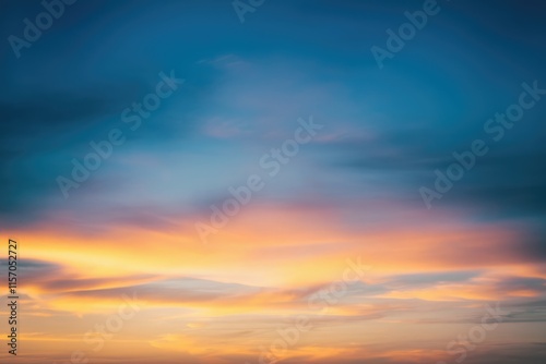 Serene sunset sky with vibrant orange and blue hues, delicate clouds painting a breathtaking scene.