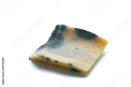 Slices of moldy ,rotten yellow cheese isolated on white background.
