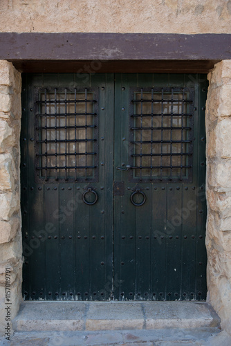 Old wooden door in the old town of Alicante, Spain. photo