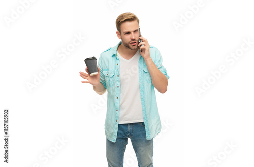 Millennial man making call on phone isolated on white. Man calling with phone and coffee. Having talking conversation. Coffee break. Morning call. Young busy man talking on phone. Dealing a problem photo