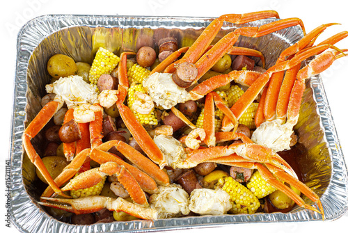 seafood boil with shellfish, Snow crab, corn on the cob, shelled shrimp, sausage, small red and white potatoes with Cajun spices the originated  in the Gulf coastal regions of the south eastern USA
