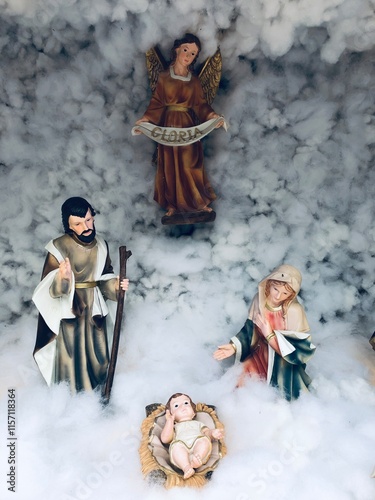 Nativity scene with family in Winter. Christmas decoration in church at India.