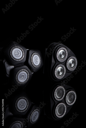 Closeup Image of 3 Blades Electric Shaver On Black Reflective Surface. Vertical image Composition