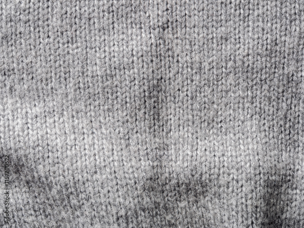 Fototapeta premium A textured gray knitted fabric ideal for cozy pieces and stylish clothing