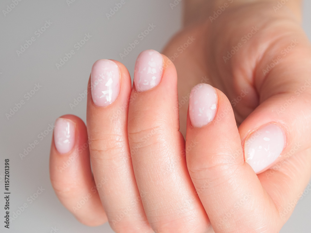 Light and delicate manicure with pastel colors, emphasizing well-groomed nails and an elegant look. Light and delicate manicure with pastel colors, emphasizing well-groomed nails and an elegant look.